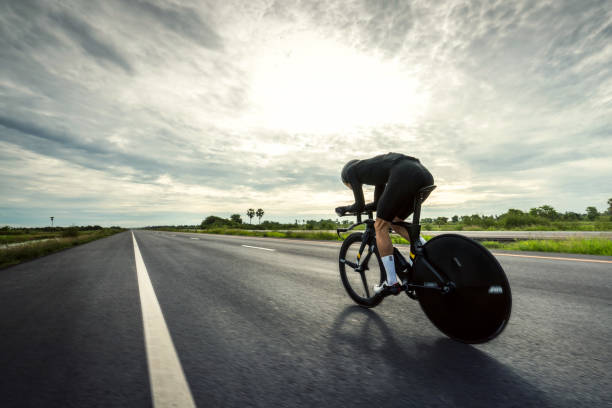 Asian men are cycling "time trial bike" in the morning