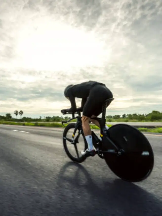 Asian men are cycling "time trial bike" in the morning