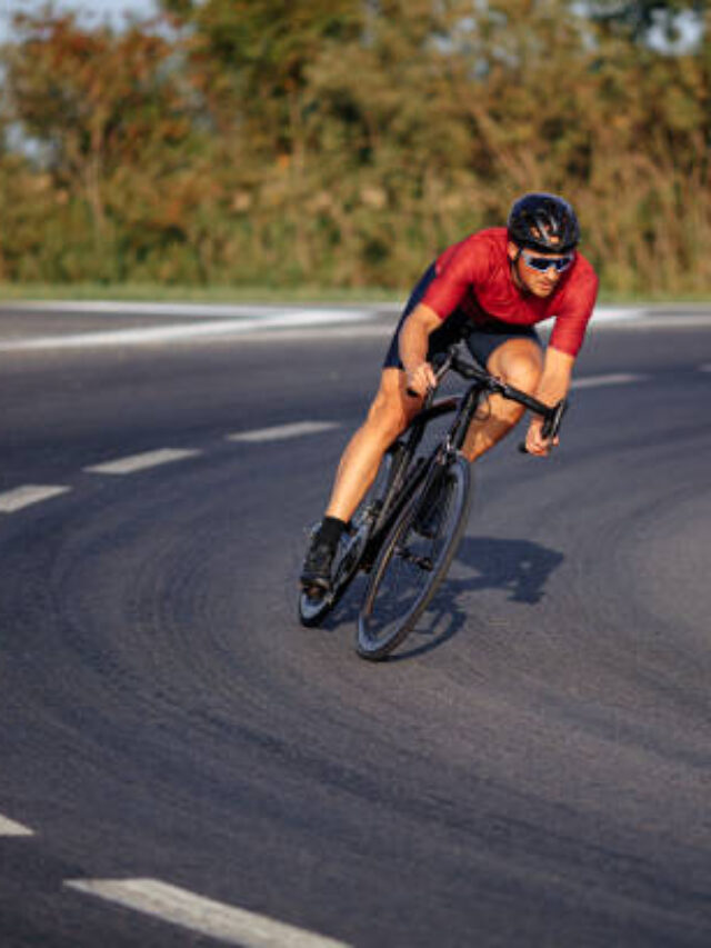 Man Riding Bicycle On Road