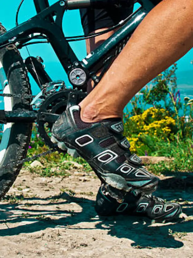 The rider's foot on a pedal bike